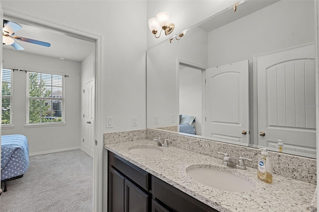 1951 Partin Terrace Rd, Kissimmee, FL 34744 - ensuite bathroom featuring double vanity, ceiling fan, and baseboards