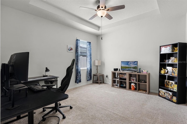 1951 Partin Terrace Rd, Kissimmee, FL 34744 - carpeted home office with a raised ceiling, a ceiling fan, baseboards, and a textured ceiling