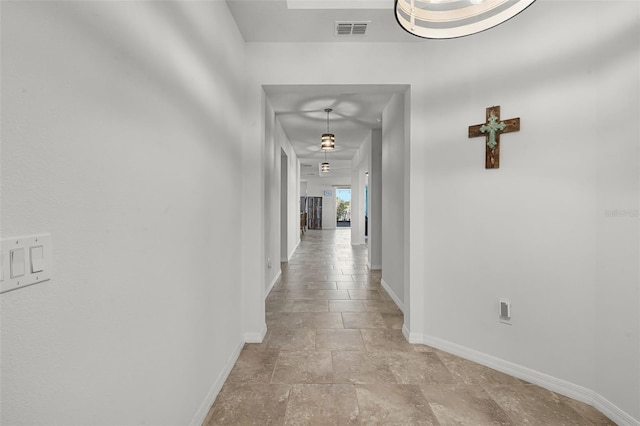 1951 Partin Terrace Rd, Kissimmee, FL 34744 - hall with baseboards and stone tile floors