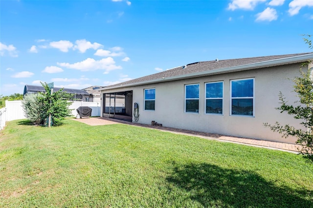 1951 Partin Terrace Rd, Kissimmee, FL 34744 - rear view of property featuring stucco siding and a patio area