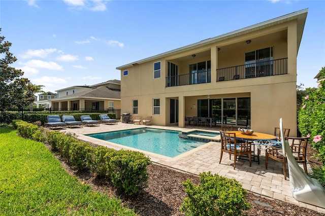 7616 Brookhurst Ln, Kissimmee, FL 34747 - view of swimming pool featuring a patio area and a pool with connected hot tub