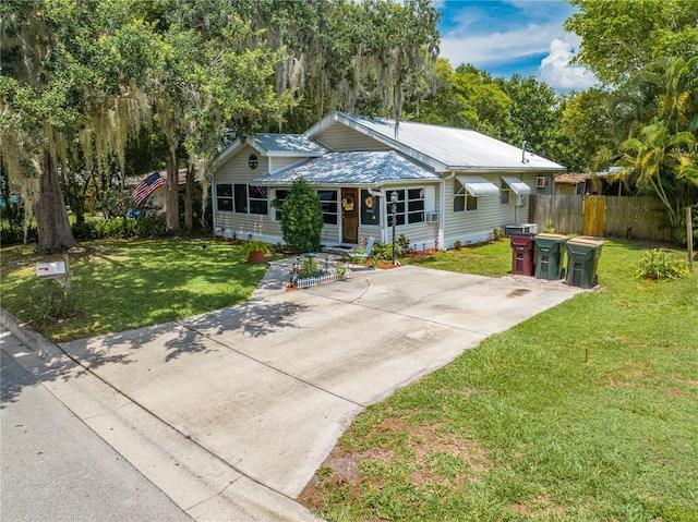 517 Carolina Ave, Saint Cloud, FL 34769 - view of front of property featuring metal roof