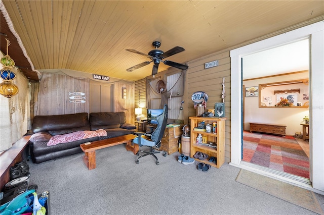 517 Carolina Ave, Saint Cloud, FL 34769 - carpeted living room featuring wood ceiling, wood walls, and a ceiling fan