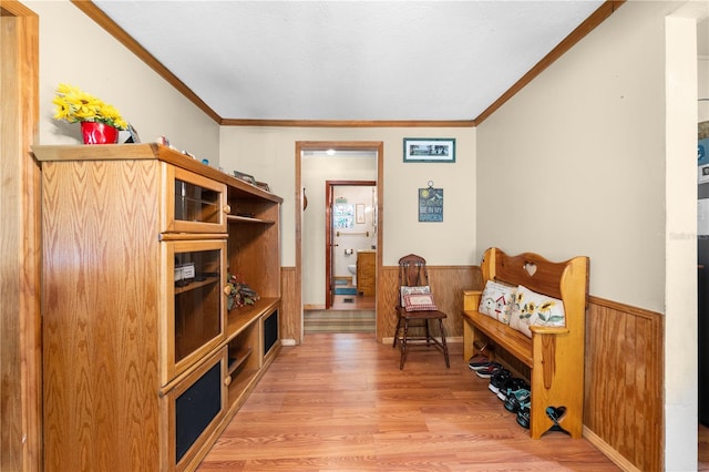 517 Carolina Ave, Saint Cloud, FL 34769 - living area featuring a wainscoted wall, wood finished floors, crown molding, and wooden walls