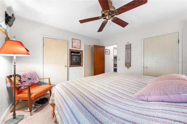 517 Carolina Ave, Saint Cloud, FL 34769 - carpeted bedroom with ceiling fan and baseboards