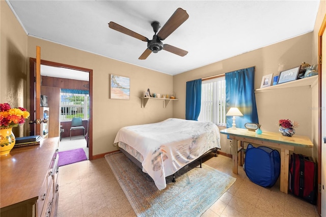517 Carolina Ave, Saint Cloud, FL 34769 - bedroom with multiple windows, tile patterned floors, baseboards, and a ceiling fan