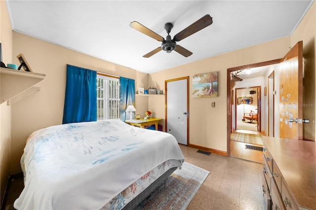 517 Carolina Ave, Saint Cloud, FL 34769 - bedroom featuring attic access, dark speckled floor, baseboards, and ceiling fan