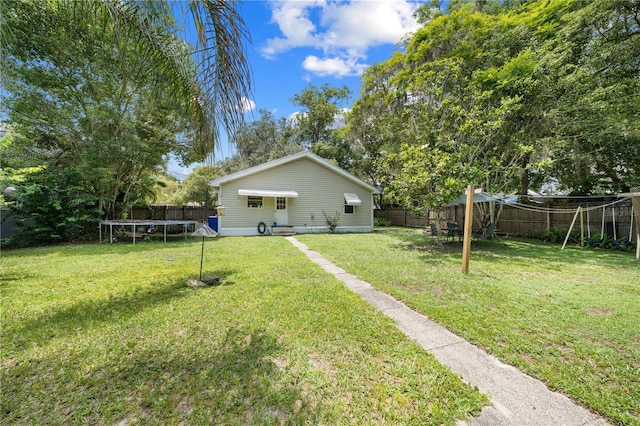 517 Carolina Ave, Saint Cloud, FL 34769 - view of yard featuring a trampoline and a playground