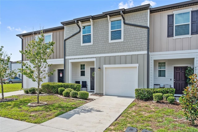 955 Grandin St, Davenport, FL 33837 - multi unit property featuring concrete driveway, board and batten siding, and an attached garage