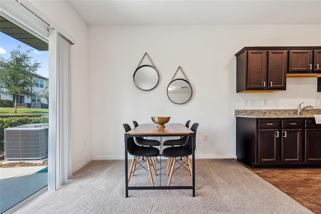 955 Grandin St, Davenport, FL 33837 - dining space featuring baseboards and light colored carpet