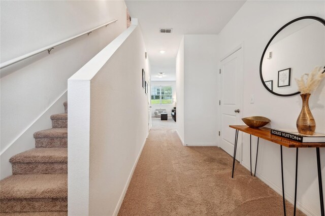 955 Grandin St, Davenport, FL 33837 - hallway with carpet floors, stairway, and baseboards