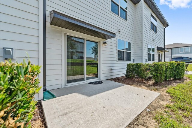 955 Grandin St, Davenport, FL 33837 - property entrance with a patio