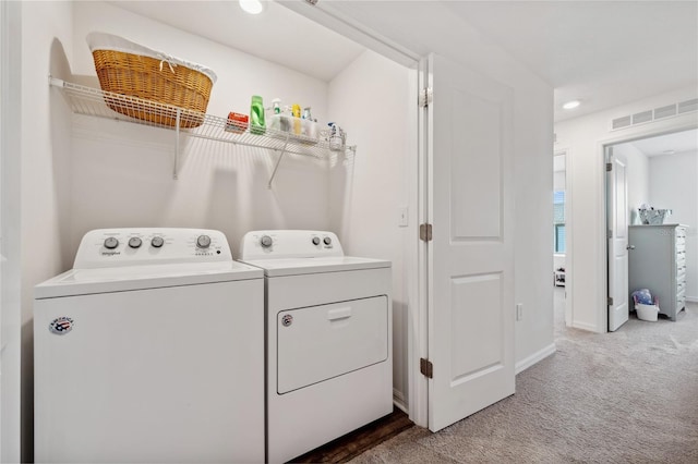 955 Grandin St, Davenport, FL 33837 - laundry area featuring washing machine and clothes dryer, carpet, baseboards, and recessed lighting