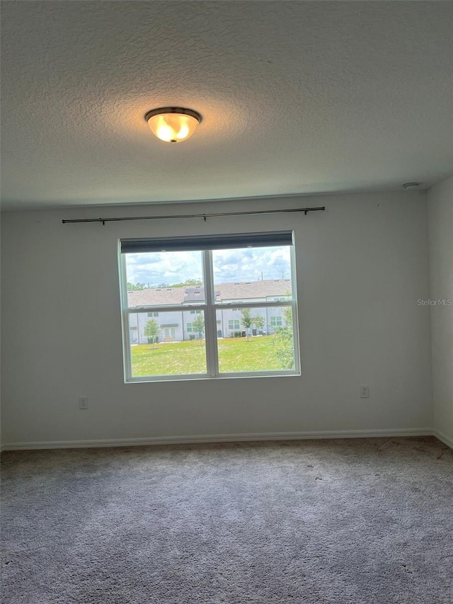 254 Mandovi St, Davenport, FL 33837 - carpeted spare room featuring a textured ceiling and baseboards
