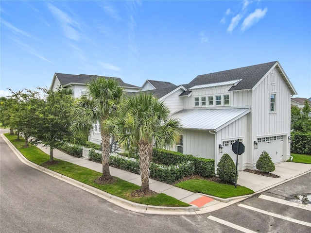 960 Civitas Way, Winter Garden, FL 34787 - view of front of house featuring a standing seam roof, board and batten siding, metal roof, a garage, and a shingled roof
