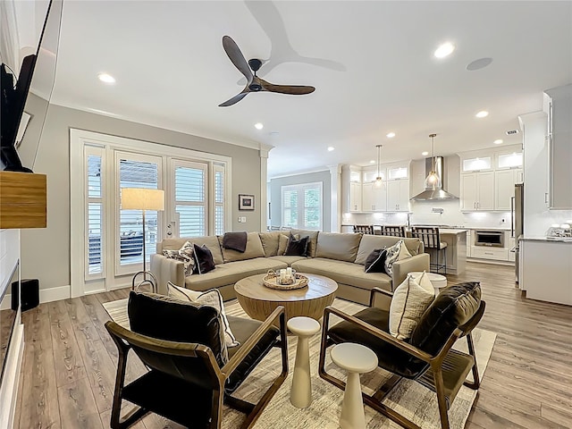 960 Civitas Way, Winter Garden, FL 34787 - living room featuring a ceiling fan, light wood-style flooring, recessed lighting, and decorative columns