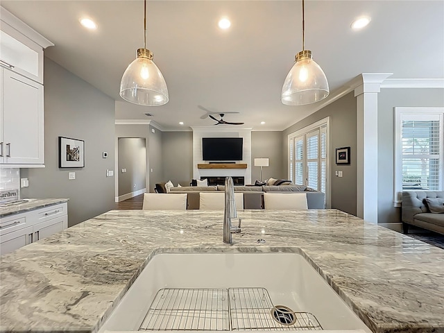 960 Civitas Way, Winter Garden, FL 34787 - kitchen featuring a ceiling fan, open floor plan, plenty of natural light, a sink, and recessed lighting