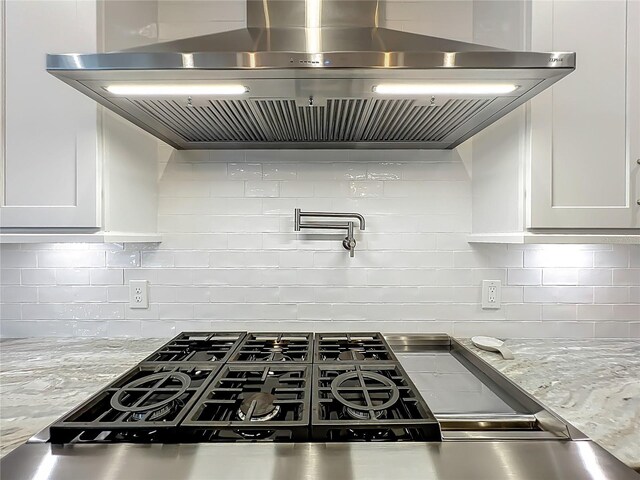 960 Civitas Way, Winter Garden, FL 34787 - kitchen featuring ventilation hood, white cabinetry, and tasteful backsplash