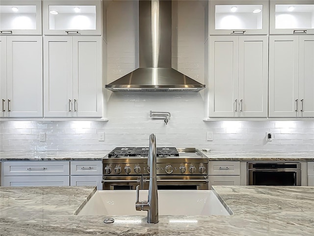 960 Civitas Way, Winter Garden, FL 34787 - kitchen featuring wall chimney range hood, stainless steel appliances, and tasteful backsplash