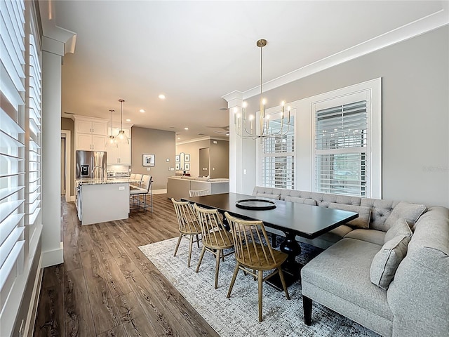 960 Civitas Way, Winter Garden, FL 34787 - dining room featuring wood finished floors, a chandelier, baseboards, and recessed lighting
