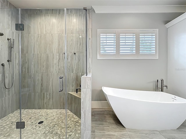 960 Civitas Way, Winter Garden, FL 34787 - bathroom featuring a freestanding bath, a shower stall, and marble look tile flooring