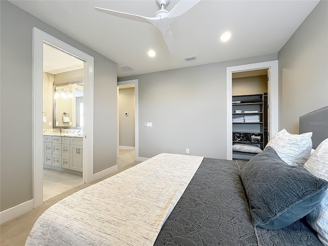960 Civitas Way, Winter Garden, FL 34787 - bedroom featuring a ceiling fan, connected bathroom, light colored carpet, baseboards, and recessed lighting