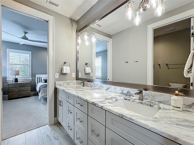 960 Civitas Way, Winter Garden, FL 34787 - ensuite bathroom with double vanity, ceiling fan, and toilet