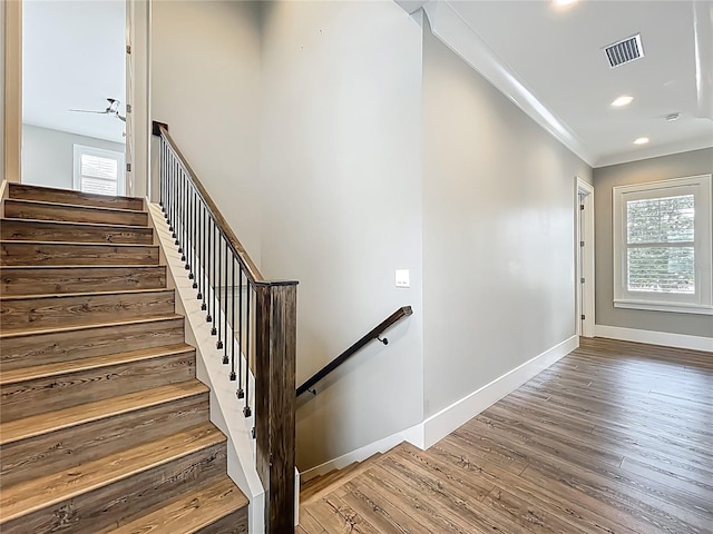 960 Civitas Way, Winter Garden, FL 34787 - stairway with wood finished floors, healthy amount of natural light, crown molding, baseboards, and recessed lighting