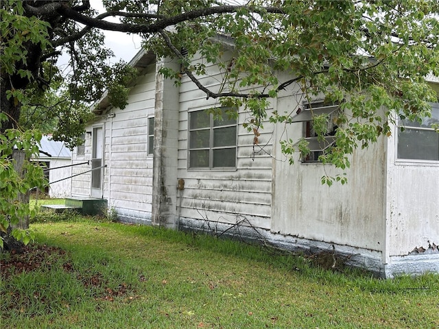 1886 Pleasant Hill Rd, Kissimmee, FL 34746 - view of side of home featuring a yard