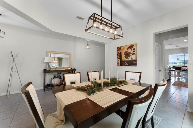 3420 Middlebrook Pl, Harmony, FL 34773 - dining area with tile patterned flooring and a chandelier