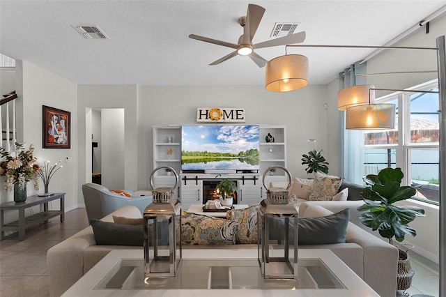3420 Middlebrook Pl, Harmony, FL 34773 - tiled living area featuring a ceiling fan and baseboards