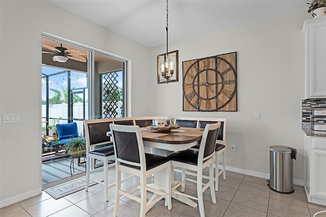 3420 Middlebrook Pl, Harmony, FL 34773 - dining room with a chandelier, light tile patterned flooring, and ceiling fan