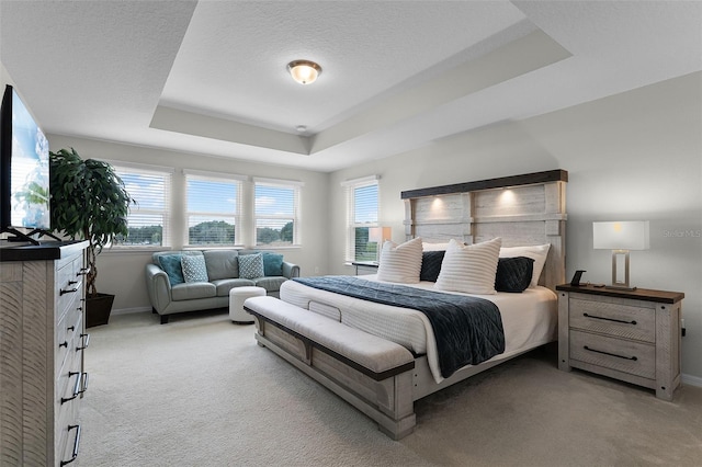 3420 Middlebrook Pl, Harmony, FL 34773 - bedroom featuring light colored carpet, multiple windows, a tray ceiling, and a textured ceiling