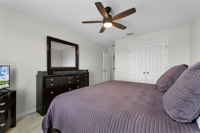 3420 Middlebrook Pl, Harmony, FL 34773 - bedroom with light carpet, a closet, and a ceiling fan
