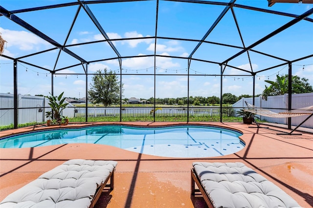 3420 Middlebrook Pl, Harmony, FL 34773 - view of swimming pool with a patio, a water view, a fenced backyard, and glass enclosure