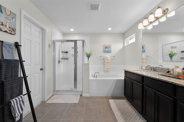 3420 Middlebrook Pl, Harmony, FL 34773 - bathroom featuring vanity, a garden tub, a shower stall, tile patterned floors, and recessed lighting