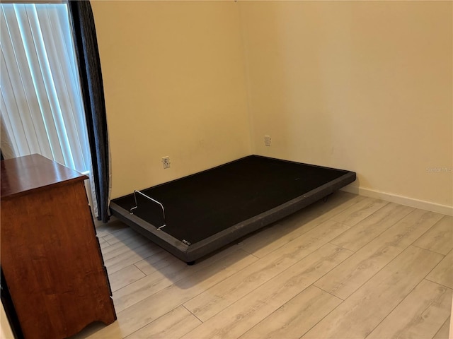 3476 Yarian Dr, Haines City, FL 33844 - unfurnished bedroom with wood finished floors and baseboards
