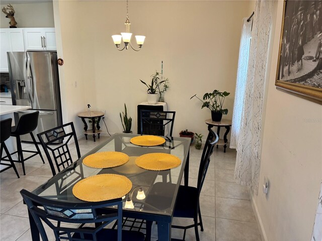 3476 Yarian Dr, Haines City, FL 33844 - dining space featuring a chandelier and light tile patterned flooring