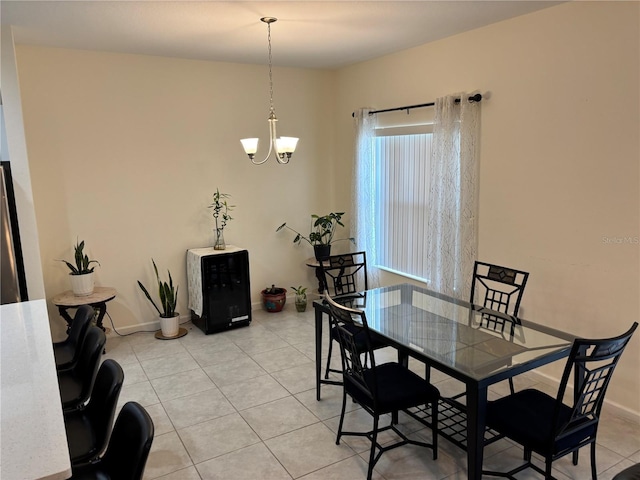 3476 Yarian Dr, Haines City, FL 33844 - dining area with light tile patterned floors, a chandelier, and baseboards