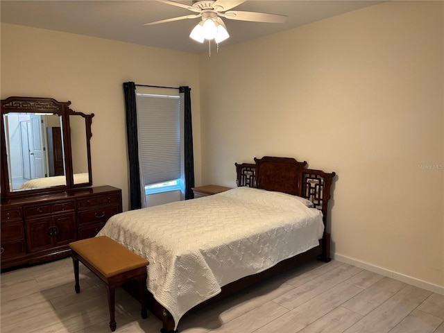 3476 Yarian Dr, Haines City, FL 33844 - bedroom featuring light wood-type flooring, a ceiling fan, and baseboards