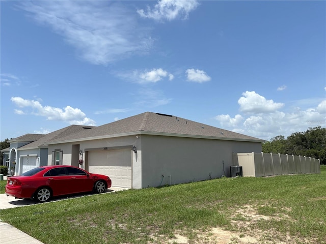 3476 Yarian Dr, Haines City, FL 33844 - view of property exterior with a garage, cooling unit, stucco siding, and roof with shingles