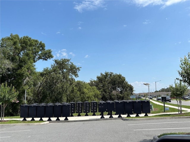 3476 Yarian Dr, Haines City, FL 33844 - view of asphalt street featuring street lights, sidewalks, and curbs
