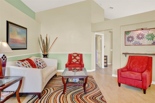 737 Oxford Dr, Davenport, FL 33897 - living room featuring wood finished floors, baseboards, and lofted ceiling