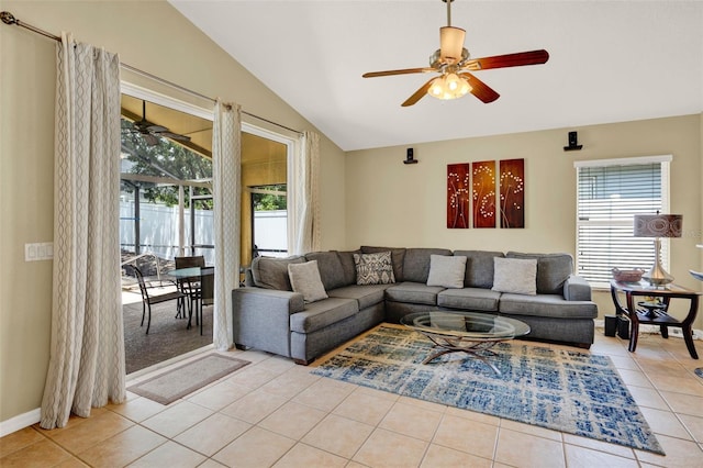 737 Oxford Dr, Davenport, FL 33897 - living room with ceiling fan, lofted ceiling, tile patterned floors, and baseboards