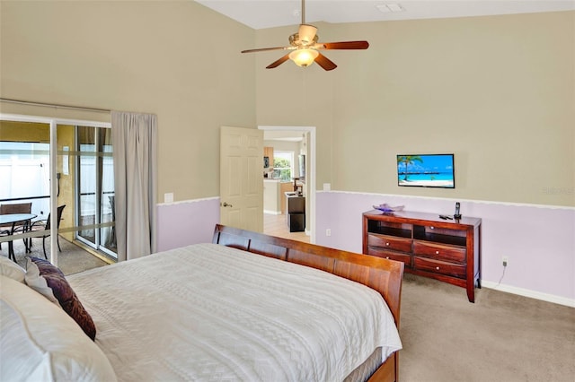 737 Oxford Dr, Davenport, FL 33897 - bedroom featuring carpet floors, a high ceiling, baseboards, and a ceiling fan