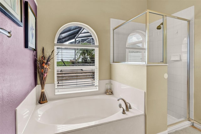 737 Oxford Dr, Davenport, FL 33897 - bathroom featuring a bath and a stall shower