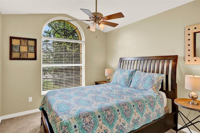 737 Oxford Dr, Davenport, FL 33897 - carpeted bedroom featuring vaulted ceiling, baseboards, and ceiling fan