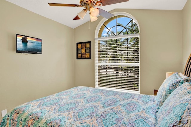 737 Oxford Dr, Davenport, FL 33897 - bedroom with vaulted ceiling and a ceiling fan