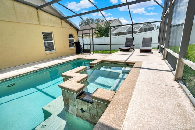 737 Oxford Dr, Davenport, FL 33897 - view of swimming pool featuring a patio, a fenced backyard, a pool with connected hot tub, and glass enclosure