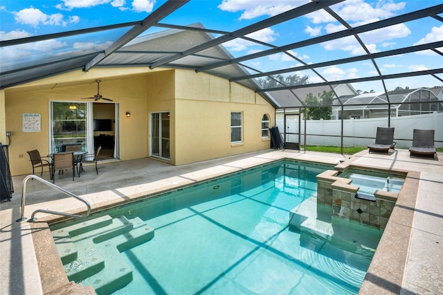737 Oxford Dr, Davenport, FL 33897 - view of pool with a patio area, a ceiling fan, a pool with connected hot tub, and glass enclosure